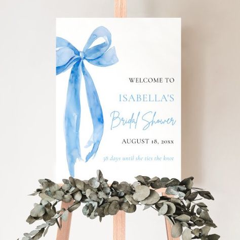 $39.00 | Blue Bow She's Tying the Knot Bridal Shower #bridal shower, bridal shower welcome sign, she's tying the knot, bow, blue bow, blue, blue bridal shower, blue and white, something blue bridal shower, elegant modern typography Something Blue Bridal, Shower Foam, Blue Bridal Shower, Elegant Typography, Shower Welcome Sign, Tying The Knot, Bridal Shower Signs, Shower Sign, Blue Bridal