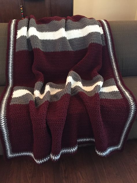 Crochet Texas A&M Bernat Blanket: This large cozy blanket was made for my nephew who will be starting A&M this fall. Size: 65" W x 80 L. Hook Size: N15, 10 mm. Yarn: Bernat Blanket. Colors& Skeins: Purple Plum (6 large), Dark Grey (2.5 large), White (1 large). Stitch: chain100, single crochet. Edge: alternating colors of single crochet all around. (2017) Crochet Blanket Dark Colors, Crochet Three Color Blanket, Crochet Blanket Patterns Bernat, Purple Crochet Blanket, Crochet Blanket Grey, Crochet Blanket Round, Symmetrical Pattern, Crochet Blanket Pattern Easy, Bernat Blanket