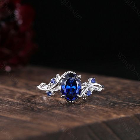 Oval cut blue sapphire engagement ring women silver gold ring unique art deco leaf ring nature branch ring September birthstone promise gift -----Ring Information----- Metal Type: 925 sterling silver, 10K/14K/18K Solid Gold, Platinum Center stone: Lab blue sapphire Stone size: 6x8mm oval shaped Side stone: Blue sapphire (contact me if you need other stones) ✦ Please feel free to contact me if you have any questions or you are interested in custom order. ✦Our Service: Custom Order All Sizes Engra Silver Sapphire Engagement Rings, Engagement Rings Silver Sapphire, Silver Sapphire Engagement Ring, Saphire Engament Ring Set Silver, Sapphire Engagement Ring Silver, Sapphire Rings Engagement, Unique Sapphire Rings, Blue Sapphire Wedding Ring, Silver Gold Ring