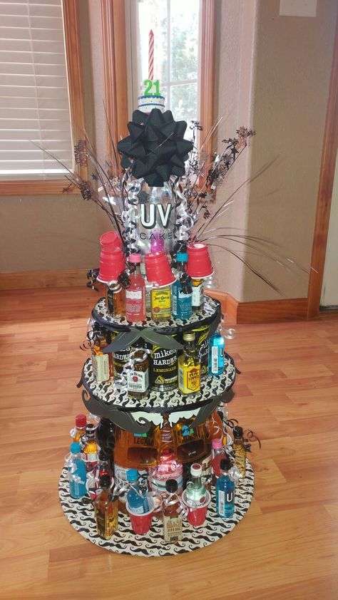 My sons 21st birthday "cake". Alcohol tower cake 21st Birthday Booze Cake, Shooter Cake 21st, 21 Alcohol Cake Tower, Booze Cake Tower, Alcohol Tower 21st Birthday, Alcohol Cake Tower, Birthday Cake Alcohol, Alcohol Tower, 21st Birthday Cake Alcohol