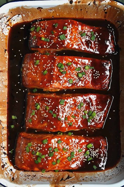 Cook tender, flaky, restaurant-quality baked teriyaki salmon in just 15 minutes with a sticky sweet homemade teriyaki sauce, sesame seeds, and green onions! A quick, simple, low-carb main! Sweet Teriyaki Salmon, Teriyaki Salmon Oven Baked, Teriyaki Marinade For Salmon, Salmon Recipes Korean, Baked Asian Salmon, Terriaki Salmon Recipe, Salmon Teriyaki Marinade, Teryikie Salmon, Teriyaki Salmon Avocado Rice Stack