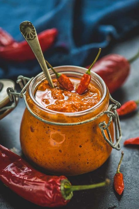 A popular, Maghrebi paste, Moroccan Harissa Sauce is a spicy red hot sauce prepared from hot chilli peppers. To give an extra flavour, ingredients like lemon juice, coriander seed, cumin seed are added to this sauce. Here is how to make Harissa Paste. #Hot #Sauce #Recipe #Homemade #Spicy #Moroccan Cookbook Photoshoot, Chilly Sauce, Spicy Sauces, Harissa Sauce, Harissa Recipes, Coriander Seed, Homemade Hot Sauce, Harissa Paste, Homemade Sauce Recipes