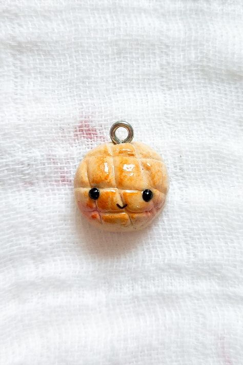 Kawaii charm made with oven-baked polymer clay. Melon Bun, Clay Phone Charm, Bun Bread, Melon Bread, Kawaii Clay, Food Kawaii, Kawaii Fruit, Clay Keychain, Fruit Bread