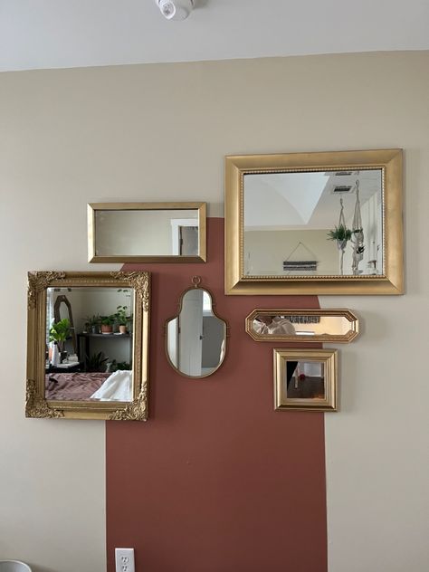 Gold mirrors of various shapes and sizes hung up on wall Paint Behind Mirror, Thrift Diy, Mirror Gallery, Mirror Gallery Wall, Bedroom Boho, Spray Paint, Mirror Wall, Gallery Wall, Spray