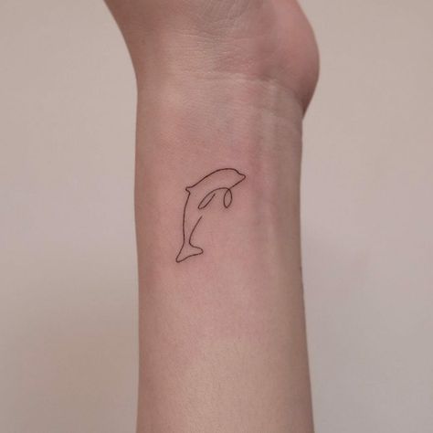 Dolphin Wrist Tattoo, Dolphin Spine Tattoos, Matching Dolphin Tattoos, Dolphin Tattoo Simple, Delfino Tattoo, Dolphin Tail Tattoo, Simple Dolphin Tattoo, Minimalist Dolphin Tattoo, Dolphin Tattoo For Women