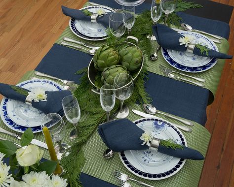 The last of my holiday guest post series for the Didriks blog I call a  Serene New Year’s table. This is a table intended for adult gatherings.  You probably have noticed that the combination of navy and green colors has  been used in fashion for the last few seasons and I think it is still fresh  to the eyes. With the white flowers, it also brings in a slight vibe of  winter. This color scheme mixed with Italian pewter tableware gives this  table the serene elegance for a more formal party ... Green And Navy Table Setting, Blue Green And White Party Decorations, Blue Green Table Setting, Blue And Green Table Setting, Navy Room Decor, Blue Place Settings, Jars Ceramics, Navy Tablecloth, Green Table Settings