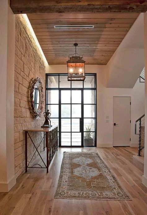 Cat Mountain Residence was designed by Cornerstone Architects in Austin, Texas. Conceived as a remodel and addition, the final design iteration for this home is uniquely multifaceted. Structural considerations required a more extensive tear down, however the clients wanted the entire remodel design kept intact, essentially recreating much of the existing home. The overall floor … Hallway Walls, Country Modern Home, Wood Columns, Casa Country, Suburban House, Small Hallways, Style Deco, Wood Interiors, Entry Way