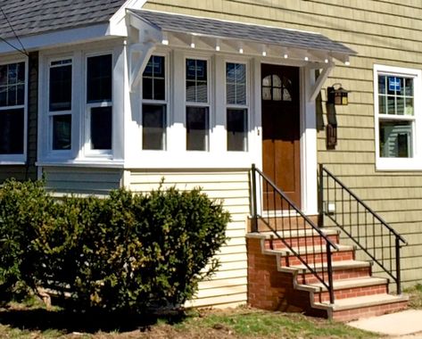 We took the old fake stone veneer off of the front steps and replaced it with real brick. Description from sopocottage.com. I searched for this on bing.com/images Enclosed Front Porch Ideas, Front Porch Curb Appeal, Enclosed Front Porch, Enclosed Front Porches, Exterior Handrail, Restoration Hardware Lighting, Porch Kits, Building A Porch, Enclosed Porches