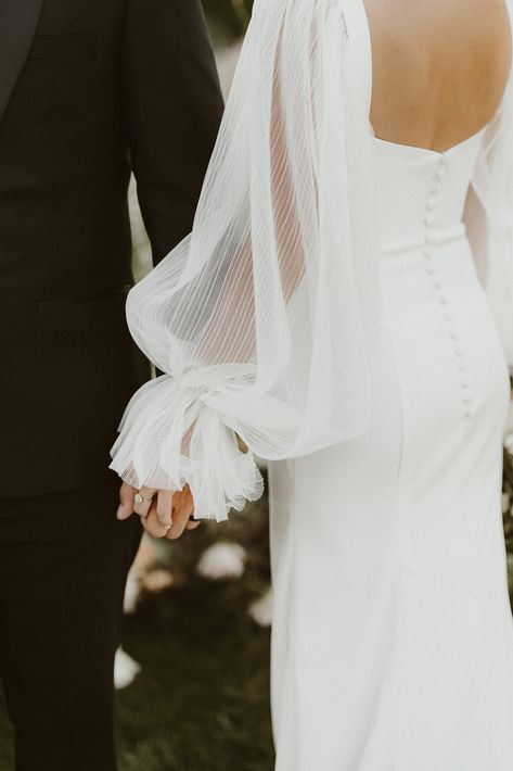 Backyardgarden party themed wedding with beautifulwhimsical details including pastel floralsa vintage car and butterfly confetti Simple Wedding Dress Romantic, Whimsical Backyard, Detachable Puff Sleeves, Wedding Sleeves, Wedding Dress Romantic, Wedding Dress 2024, Wedding In Colorado, Simple Wedding Dress, A Wedding Dress