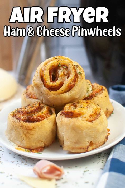 Making lunchtime fun can be a challenge, but with these air fryer ham and cheese pinwheels, you'll have a delicious and easy option that your kids will love. These tasty snacks are simple to make and perfect for packing in a lunchbox. Plus, they're always a hit at parties! Give them a try today. Air Fryer Pinwheels, Crescent Sandwiches, Air Fryer Ham, Ham And Cheese Roll Ups, Fried Ham, Sandwich Cream, Ham And Cheese Pinwheels, Cream Cheese Roll Up, Cheese Pinwheels