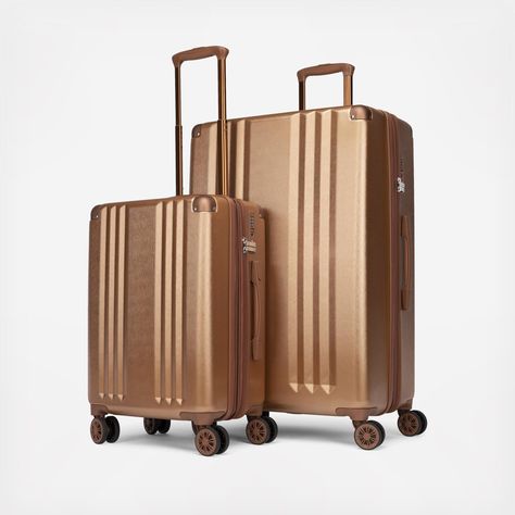 Get noticed everywhere you go and get there efficiently with the show-stopping Ambeur Luggage Collection. Inspired by shimmering metallics, this Ambeur set is the perfect match for anyone looking for both function and style. Both the carry-on and larger case are lightweight yet durable. The hard-shell body helps protect the large main compartment. And if you ever need to run to your gate, the 360-degree spinner wheels will make it easy to do so.**Features:** - Lightweight and durable hard-shell Hanging Toiletry Bag, Lightweight Luggage, Checked Luggage, Suitcase Set, Tsa Approved, Laptop Tote, Key Pouch, Luggage Cover, Vanity Case