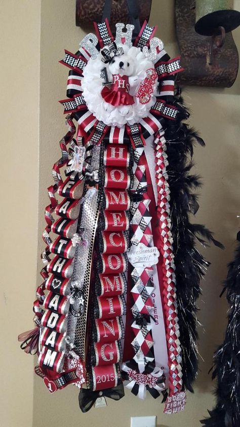 Maroon, black, silver, and white!! “Not Your Average Mum” handcrafted by Amanda Morse!! Maroon Black And White Homecoming Mum, Homecoming Mum Junior Ideas, Red White And Silver Homecoming Mums, Red Black White Homecoming Mums, Maroon And White Homecoming Mums, Red Black And White Homecoming Mums, Red And Black Mums Homecoming, Red Mums Homecoming, Maroon And White Mums Homecoming