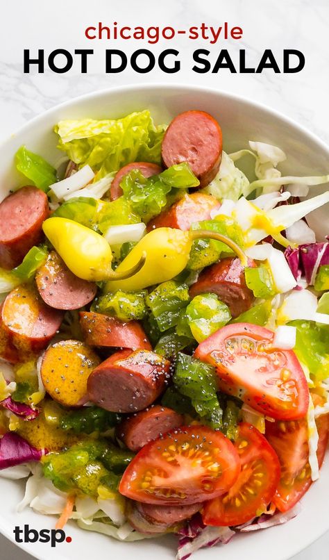 The infamous loaded hot dog just got a fresh makeover. Tossed with honey-mustard dressing in a bowl with all of the toppings (pickles, banana peppers, onion, and tomatoes) you won't believe how good your beloved Chicago dog is sans bun. Hot Dog Salad, Healthy Hot Dog, Chicago Style Hot Dog, Chicago Hot Dog, Low Carb Salad, Hot Dog Recipes, Main Dish Salads, Chicago Style, Stuffed Banana Peppers