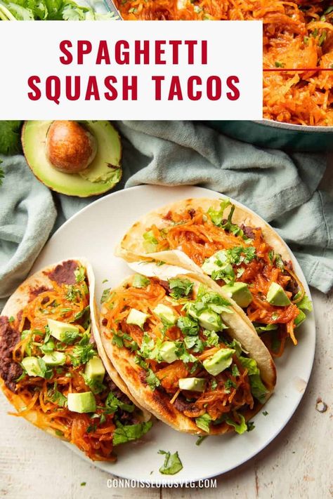 These spaghetti squash tacos are the delicious fall dinner you probably didn't know you needed in your life! They're made with refried beans and barbecue "pulled" spaghetti squash filling stuffed into crispy tortillas and piled high with your favorite toppings. Taco Stuffed Spaghetti Squash, Spaghetti Squash Taco, Mexican Spaghetti Squash, Squash Tacos, America Recipes, Potatoe Recipes, Vegetarian Meatballs, Healthy Vegan Dinner Recipes, Healthy Vegan Dinner