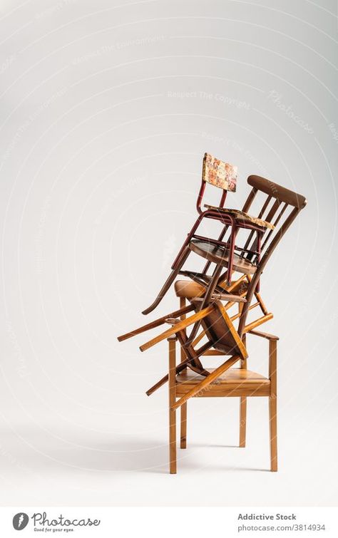 Set of old chairs stacked against white background - buy this Royalty Free Stock Photo on furniture pile messy disordered seat wooden old-fashioned classical. Old Chair, Old Chairs, Studio Shoot, Old Furniture, Furniture Styles, Furniture Chair, Old Fashioned, Outdoor Chairs, White Background