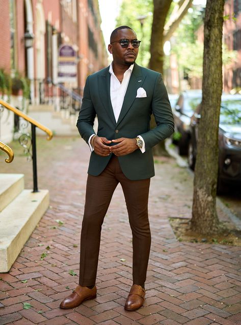 Elevate your wardrobe with a dark green suit jacket paired with brown dress pants and a white dress shirt, finished with stylish brown monk strap shoes. A perfect blend of elegance and unique style for any formal or business casual event. Unique Men’s Wedding Outfit, Green Jacket Brown Pants, Dark Green Jacket Outfit Men, Green And Brown Outfit Men, Brown Suit Outfit, Dark Green Pants Outfit, Green Blazer Outfit Men, Brown Monk Strap Shoes, Brown Shoes Outfit