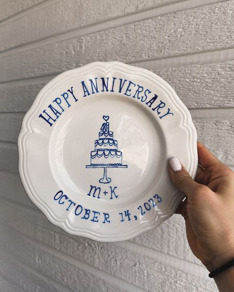 happy wedding anniversary plate 🍰💍 M+K=🤍 Hand-drawn wedding plate made with a blue porcelain pen, baked in the oven at 350°, and sealed with @modpodgecrafts to be food-safe! #weddinganniversary #weddinganniversarycake #weddinganniversarygift #weddinganniversarygifts Porcelain Pen Ideas, Paint Your Own Pottery Serving Platter, Hand Building Plates, Ceramic Painting Ideas Plates Hand Drawn, Anniversary Plates Diy, Wedding Cake Plate Pottery, Anniversary Plate Ideas, Wedding Gift Pottery, Diy Porcelain Plate Art