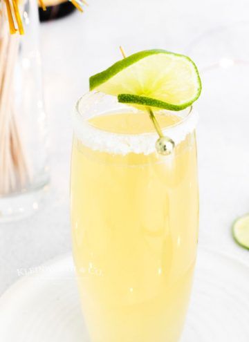 Kleinworth & Co. - A lifestyle blog with simple family recipes, DIY projects & crafts on a budget. Champagne Margarita Recipe, Holiday Party Punch, Champagne Margarita, Sparkling Margarita, Easy Party Drinks, Champagne Margaritas, Holiday Party Drinks, Bourbon Apple Cider, Thanksgiving Punch