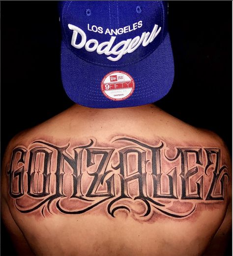 Amazing artist Jorge Jamaica from Pomona @jamaica.tatts awesome Gonzalez script back piece!  #jorgejamaica #jorge #jamaica  #gonzalez  #renaissance  #ink #3d  #tattoos #tattoo  #amazing  #lettering  #portraits #arm #blackandgrey #italian #scripttattoo #photorealism #portrait  #amazing  #la #backtattoo #back #fresh #calligraphy #art #artwork #europe #portrait  #script #west Tattoo Nombres, Florida Tattoo, Florida Tattoos, Lion Tattoo Sleeves, Tattoo Lettering Design, La Tattoo, Tattoo Lettering Styles, Cursive Tattoos, Chicano Tattoos