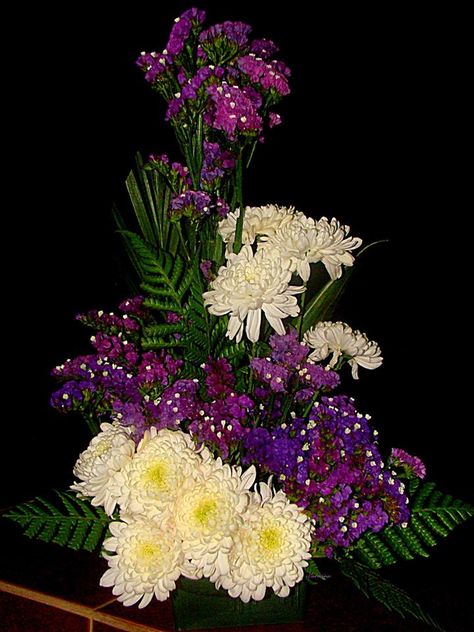 White mums and purple statice flowers. Statice Flower Arrangement, Statice Flowers, Statice Flower, Purple Statice, White Mums, Church Flower Arrangements, Garden Angels, Florist Shop, Flowers Arrangements