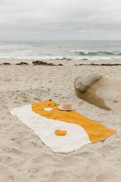 A superior quality heavyweight blanket designed with lazy summer days in mind. Custom made for Seaesta Surf in a large-scale handwoven yin yang pattern. This yellow + white color palette will brighten up any home or work perfectly for a beach or outdoor adventure. Each blanket is handwoven and patterns or colors may vary slightly. Colors: mustard yellow and white Measures approximately 7'x4' Heavy Weight Acrylic/Polyester/Cotton Blend Made in Mexico **Patterns and stitching may vary slightly due Beach Clothing Ideas, Cute Beach Towels, Yin Yang Pattern, White Color Palette, Swimwear Aesthetic, Mexican Beach, Beach Trends, Beach Ware, Mexican Beaches