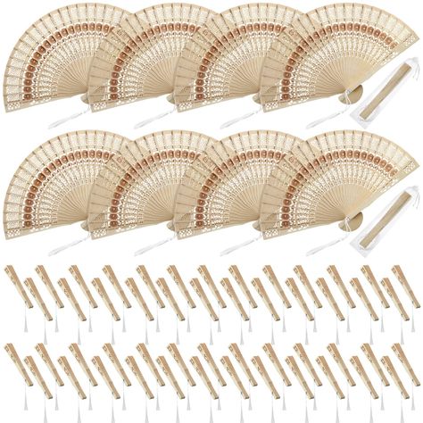 PRICES MAY VARY. Package include: you will get 50 pieces folding hand fans, these fans feature hollowed out engraving design, sunflower pattern, which symbolizes a positive attitude towards life, it can keep you cool in the summer and decorate your home and office Quality material: these foldable hand fans are made of sandalwood, well handmade, vintage retro style, the wooden folding fans come with natural scent, cool and elegant in summer hot days Fan size: the hand held folding fan length is 2 Fans For Wedding, Baby Shower Gift Favors, Fan Favors, Folding Fans, Rustic Modern Wedding, Folding Hand Fan, Favors Birthday, Boho Birthday, Wedding Gift Bags