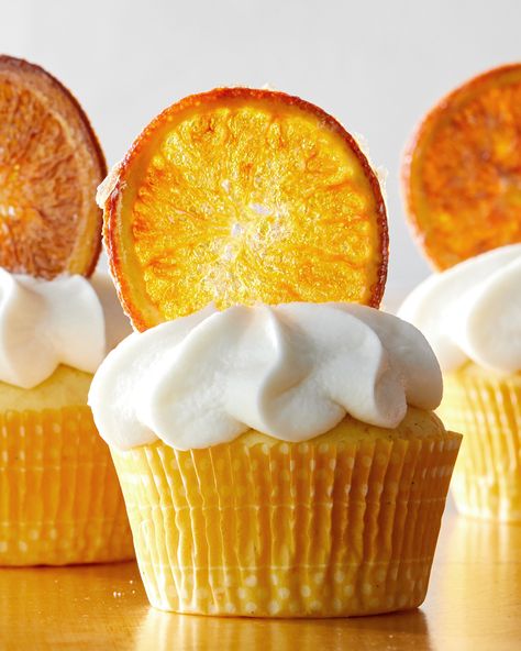 Orange Curd Cupcakes | Bursting with citrusy flavor, these cupcakes have orange zest in the batter and homemade orange curd in the filling.  Swirls of vanilla buttercream crowned with dried orange slices take them over the top.  #cupcakes #desserts #marthastewart #baking Orange Curd, Summer Cupcakes, Orange Cupcakes, Dried Orange Slices, Dried Oranges, Wedding Dessert, Vanilla Frosting, Savoury Cake, Orange Slices