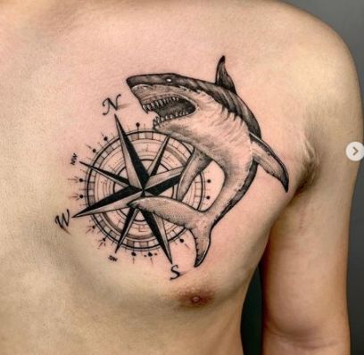 Shark & Compass Tattoo On Chest Shark Chest Tattoo, Unique Compass Tattoo, Traditional Compass Tattoo, Small Compass Tattoo, Geometric Compass, Tattoo On Chest, Stormy Waters, Anchor Tattoo Design, Compass Tattoo Design