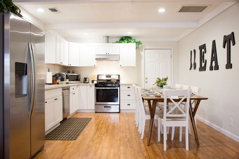 Orange Wood Flooring Living Room, Orange Oak Floors Wall Colors, Orange Wood Floor Kitchen, Orange Wood Floor Living Room Decor, Kitchen With Orange Wood Floors, Yellow Wood Floors Kitchen, Orange Wood Floor Living Room, Contemporary White Kitchen, Floor Stain Colors