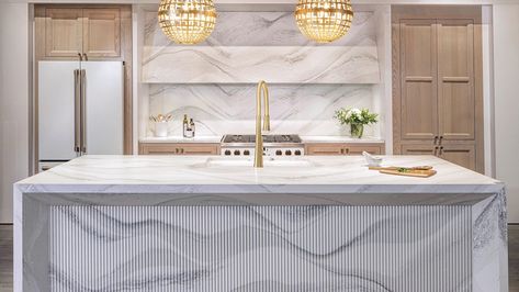 Minnesota-based Cambria recently debuted three designs: the stunning Brittanicca Gold Cool, Hailey, and Harlow—all part of its Luxury Series that features a mix of cool and warm tones that evoke organic forms. See what else is new in the world of flooring and surfaces at the link below. 📸: Sage E. Imagery Beachy Kitchen Ideas, Kitchen Island Shapes, Cambria Countertops, Engineered Quartz, Cambria Quartz, Coastal Kitchen, White Countertops, House Design Photos, Bath Products