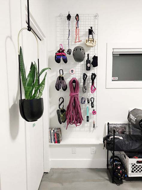 Climbing gear grid-wall organization system Surf Gear Storage, Diy Gear Wall, Hiking Gear Peg Board, Gym Gear Organization, Climbing Gear Aesthetic, Gear Storage Wall, Climbing Equipment Storage, Climbing Gear Wall, Climbing Organization