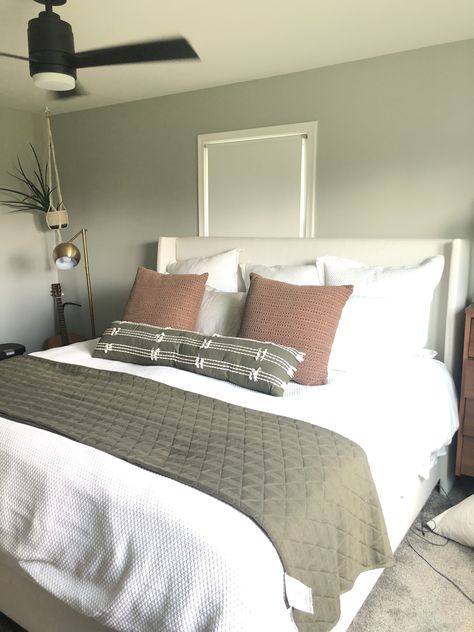 Gray White And Olive Green Bedroom, White Bed Green Walls, Overtly Olive Bedroom Ideas, Olive Green Guest Room, Bedroom Inspirations Olive Green, Green Bedroom White Bed, Olive Wall Bedroom, Olive Green And Blush Bedroom, Bedroom With Olive Green Accents