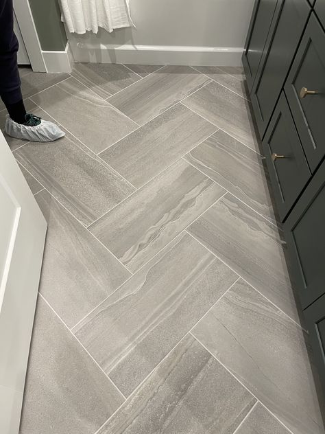 Grey Rectangle Tile Bathroom, Large Herringbone Tile Floor Bathroom, 12x24 Herringbone Floor Tile, Gray Bathroom Floor, Grey Shower Tile Ideas, Gray Bathroom Floor Tile, Big Tiles Bathroom, Bathroom Flooring Ideas, Small Bathroom Renos