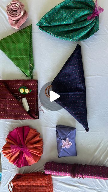 Shruthi Gowda😍 on Instagram: "Quick and easy blouse piece return gift wrapping ideas.

Make this upcoming festival beautiful and memorable using creative ideas. It is customary to put a Blouse piece in a tamboolam for wishing the prosperity for guests.

In video I used masking tape which is easily removable and doesn’t damage the cloth.

Varamahalakshmi series -2 (Creative return gift ideas)
9 different types of blouse wrapping ideas uploaded in my YouTube channel, Thank you ❤️
.
.
.
.
.
#kannadavlogs #happymom #reelsofinstagram #reels #returngiftideas #creativity #blousepiece #wrappinggifts #varamahalakshmifestival #festivaldecoration #tradition #indian #southindian #creativeideas #explorepage" Gift Wrapping A Dress, Blouse Piece Design, Blouse Piece Packing Ideas For Wedding, Blouse Packing Ideas For Wedding, Diy Return Gifts Indian, Unique Return Gift Ideas, Blouse Piece Folding Ideas, Return Gift Packing Ideas, Bridal Gift Wrapping Ideas Creative