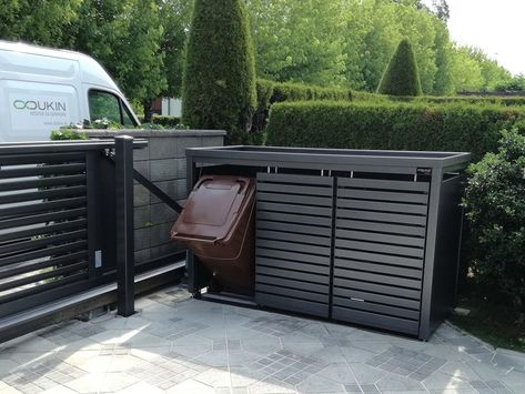 The photo shows a StyleOUT® waste enclosure placed on a driveway Bin Enclosure, Marina Village, Waste Container, Waste Bin, Bodo, Bathroom Layout, Storage Bins, Metal Decor, Outdoor Storage Box