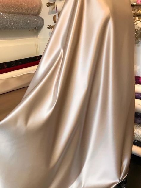 Luxurious Champagne Duchesse satin. Perfect for bridal and evening wear gowns. Nice underlay for dark tulle as well as light tulle.Imported.Sold by the yard. $57 per yard54 inch width.Dry clean.100% silk