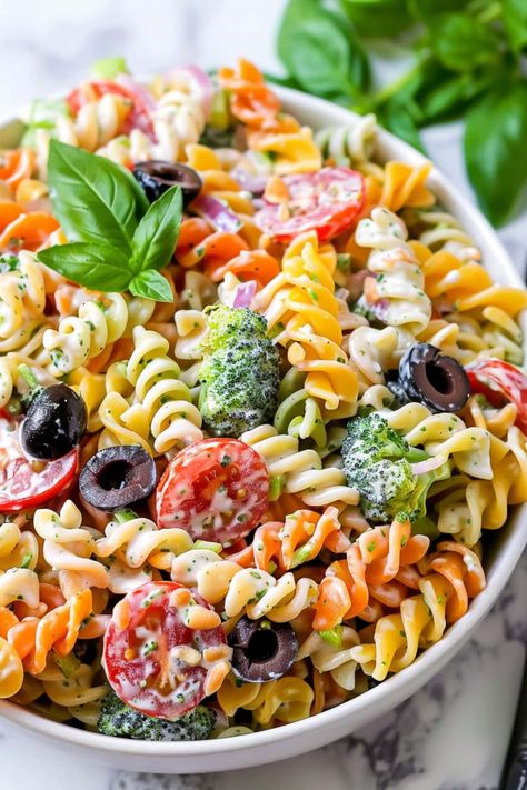 This tri-color pasta salad is guaranteed to wow a crowd! Loaded with veggies, mozzarella, and a tangy Caesar dressing, it's full pf delicious flavor. Colorful Pasta Salad, Tri Color Pasta Salad Recipe, Color Pasta Salad, Tri Color Pasta Salad, Tri Color Pasta, Colored Pasta, Summer Sandwiches, Pasta Types, Red Onion Relish