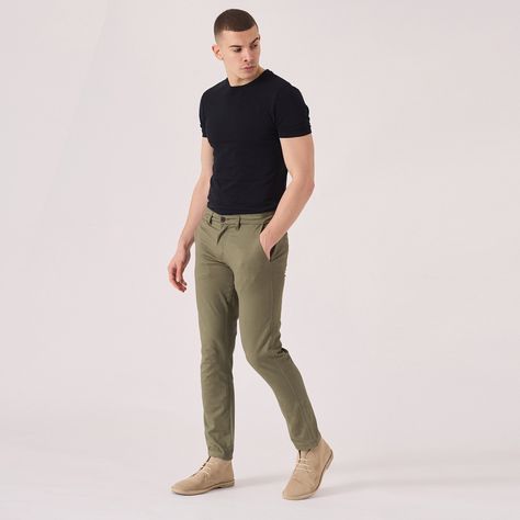 "Introducing our stylish Regular Fit Stretch Chino Trouser in a refreshing Light Green shade. Designed for both comfort and style, these trousers are made with a stretch fabric to ensure a perfect fit. Ideal for any occasion, dress them up or down with ease. The classic chino design features an adjustable waistband and button closure for a secure and tailored look. Upgrade your wardrobe with these versatile and trendy chinos that will give you a polished and effortlessly cool vibe. Product Features: Light Olive Green Stretch Fabric Regular chino fit Tonal buttons Welt pockets to back 98% cotton 2% spandex Our Model is 5'11\" and wears size 32. To find the perfect fit for yourself, check our Size Guide FIND YOUR SIZE and check our size guide to find your perfect fit. Size = 30 - 40 Waist = Green Chino Outfit Men, Olive Trousers Outfit, Men Chino Outfit, Olive Green Pants Outfit, Chinos Men Outfit, Trousers Outfit Men, Casual Look For Men, Green Pants Men, Olive Chinos