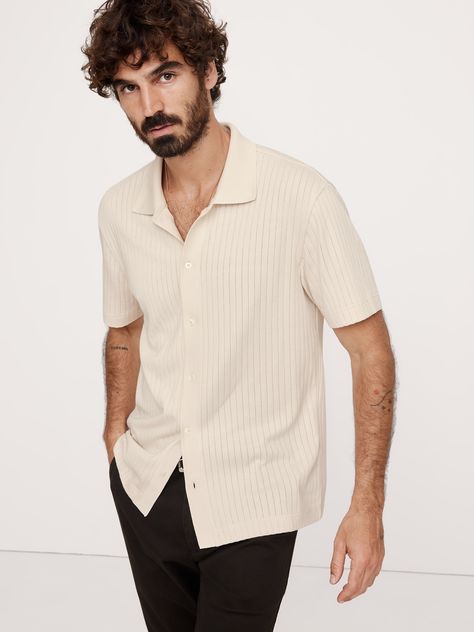 This vintage-inspired style is cut from an ultra-soft fabric of modal mixed with cotton.  Here, we added a wide ribbed-knit texture for a luxuriously retro look.  Standard fit.  Polo collar.  Button front.  Straight hem.  Standard fit.  Short sleeves.  Hip length.  Model: Size M, 6'2" (188cm). Resort Shirt, Ribbed Shirt, Knit Texture, Retro Look, Polo Collar, Hip Length, White Cotton, Soft Fabric, Soft Fabrics