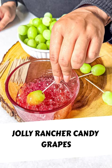 Candy grapes are sweet and sour candy-coated grapes, dipped in melted jolly ranchers then more crushed candy for a delightful crunch. Candied Jolly Rancher Grapes, Fairy Food Candy, Candy Apple Grapes Recipes, Healthy Candy Grapes, Jolly Rancher Melted Candy, Grapes And Jolly Ranchers, Melting Jolly Ranchers In Microwave, How To Make Candy Grapes With Jolly Ranchers, How To Make Candied Grapes With Jolly Ranchers