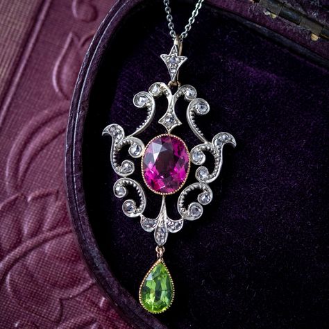 Stunning! 🌷 This incredible Suffragette piece is new in at Laurelle A beautiful antique Edwardian Suffragette pendant adorned with a pear-cut peridot dropper (approx. 1ct) and a central oval-cut tourmaline with a deep pink hue (approx. 3ct). The gallery has a fabulous Art Nouveau design with scrolling, foliate motifs decorated with twinkling rose-cut diamonds (approx. 0.34ct total). Jewellery displaying the colours green, violet and white were often worn in support of the Women’s Social a... Edwardian Suffragette, Suffragette Jewellery, Suffrage Movement, Edwardian Engagement Ring, Arm Art, Platinum Chain, Edwardian Jewelry, Art Nouveau Design, Rocks And Gems