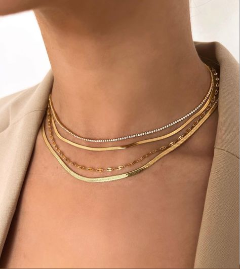 Dainty gold necklaces stacked to create a more polished look. #goldjewellery #goldnecklaces #necklacestack @shopccluxury Stacked Tennis Necklace, Necklaces Stacked, Necklace Gold Jewelry, Necklace Stack, Herringbone Chain, Minimal Necklace, Snake Necklace, Luxury Necklace, Dainty Gold Necklace