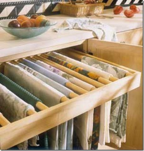 A pullout drawer fitted with dowel rods makes for a great wrinkle-free way to store linens. Tablecloth Storage Hanging, Tablecloth Storage, Storing Fabric, Table Linen Storage, Essex House, Linen Storage Cabinet, Linen Closets, A New Start, Future Kitchen