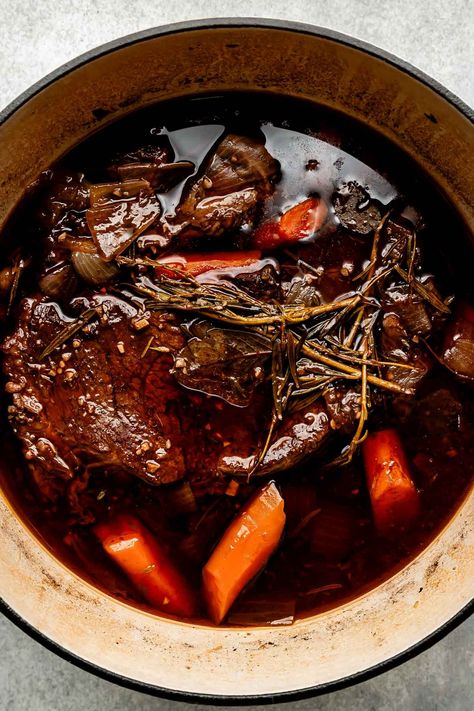 You don't need an expensive cut of beef to make a restaurant-worthy meal – this Red Wine Braised Beef recipe is proof! Slowly simmer beef chuck roast with red wine, vegetables, & herbs until it transforms into a succulent centerpiece complete with a built-in red wine sauce. Serve with creamy mashed potatoes for the best cozy dinner! (Slow cooker/Crockpot & Instant Pot directions provided.) #redwinebraisedbeef #redwinebeefroast #braisedbeef ##braisedbeefroast #beefroast #beefrecipes #dinnerideas Red Wine Beef Roast, Roast With Red Wine, Red Wine Braised Beef, Wine Braised Beef, Dinner Slow Cooker, Braised Beef Recipes, Chuck Roast Recipes, Slow Cooker Roast, Cozy Dinner