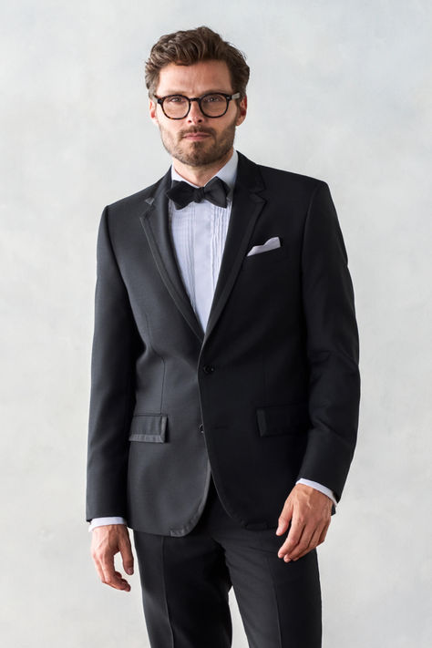 Turn heads with this black notch lapel tuxedo inspired by the traditional ivy league rowing blazer with silk grosgrain ribbon on the edge of the lapels, closure, and pockets. Includes jacket and pants. Pants are available in classic and slim fits. Shop The Black Tux today! Suit Prom, Black And White Tuxedo, Spring Formal, White Tuxedo, Dress Suits For Men, Black Tux, Tuxedo Pants, Delta Zeta, Poses Reference