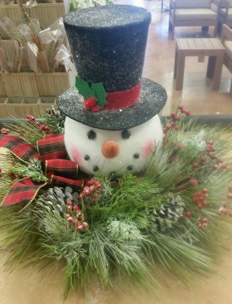 Snowman head centerpiece I made today Snowman Head Centerpiece, Snowman Head Wreath, Snowman Centerpieces Diy, Snowman Centerpiece Ideas, Snowman Centerpieces, Christmas Floral Arrangements Diy, Cone Christmas Decorations, Snowman Wreaths, Pine Cone Christmas Decorations