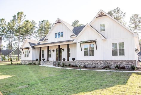 Farmhouse White Windows Exterior, White Board And Batten Exterior With Rock, White Farmhouse With White Windows, Farmhouse Exterior White Windows, One Story Farmhouse Exterior Design, White Farmhouse White Windows, Modern Farmhouse White Windows, White Board And Batten Exterior With Stone, Farmhouse With White Windows