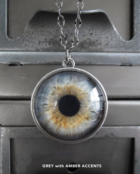 Definitely 'eye-catching'! This off-beat, creepy-cool eyeball necklace features a fantastically life-like, glossy, two-sided eyeball pendant - with your choice of colors! Funky & sugar-free, Halloween trick-or-treat gift for your goth ghoul or goblin! Shiny glass round eyeball: approx. 1-1/16" dia (27mm) Two-sided silvertone bezel (1-1/4" total height) Select from 'Aqua/Soft Green', 'Aqua/Grey' or 'Pale Blue/Soft Green' Black gunmetal chain in 20" or 26" Prefer custom length or color combo? Just