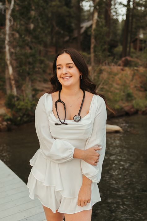 Graduation photos | nursing school | stethoscope | white dress | truckee | water Nurse Grad Pics, Nursing Photoshoot, Nursing Pictures, Nursing Graduation Pictures, Outdoor Portrait Photography, College Graduation Photos, Pa School, Graduation Pics, Nursing School Graduation