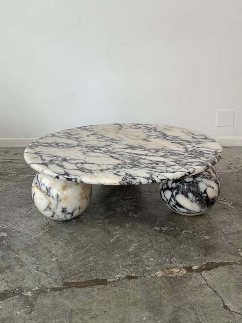 For Sale on 1stDibs - Untreated natural marble table. The overall structure is in marble. The circular top rests directly on three solid spheres. In very good condition. Lounge Room Aesthetic, Travertine Table, Round Marble Table, Marble Round Coffee Table, European Casual, Marble Home, Travertine Coffee Table, Solid Coffee Table, Honed Marble